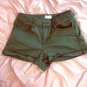 Army green mid rise shorts.